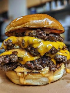 a cheeseburger with meat and melted cheese on it