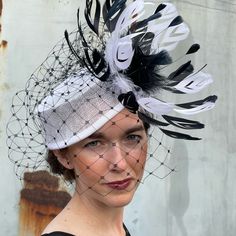 This Handmade One Of A Kind Fascinator Is Fun And Elegant And Is Sure To Delight. Designed With High Quality Sinamay, French Made Grosgrain Ribbon, Vailing And Premium Feathers. Comes With A Hat Box. This Fascinator Will Make A Wonderful Addition To Your Kentucky Derby, Or Ascot Ensemble Fitted White Hat Headpiece, White Fitted Fascinator For Royal Ascot, White Fitted Hat With Pinched Crown, Fitted White Headpiece For Church, White Fitted Headpiece For Formal Occasions, Chic Fitted White Mini Hat, White Pinched Crown Hat For Party, White Pinched Crown Hat For Parties, White Party Hat With Pinched Crown