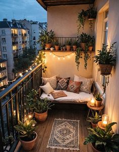 an outdoor balcony with potted plants and lights