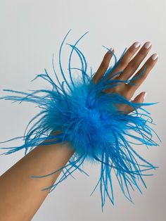 Description Say hello to our 100% Ostrich feather cuffs. A must have accessory to add to your closet! Not only can she be worn with multiple tops, dresses and blazers but she can also add drama to your ankle strap heels! Style her in multiple ways for day or night time outings! Details 100% Ostrich fur 2 inches wide 10 inches long Snap on Adjustable fit One size fits all Carnaval Inspo, Dresses And Blazers, Feather Applique, Seussical Costumes, Cuffs Diy, Sea Costume, Feather Accessories, Eras Outfit, Carnival Celebration