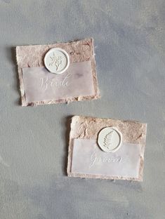 two stone coasters with the words bride and groom engraved on them