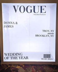 an advertisement for the wedding of the year is displayed in front of a large poster