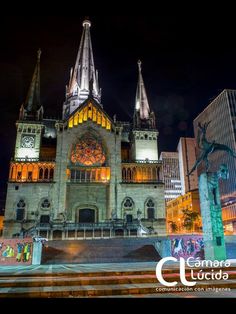 the cathedral is lit up at night time