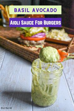 an avocado sauce for veggie burgers in a jar