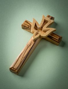 a wooden crucifix with the word jesus carved into it's cross