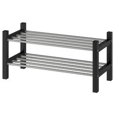 a black and silver shelf with two metal bars on it's sides, against a white background