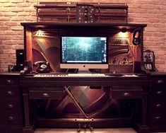 a computer monitor sitting on top of a desk in front of a brick wall with bookshelves