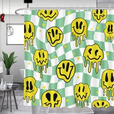 a shower curtain with yellow smiley faces on green and white checkerboard pattern, hanging in a bathroom