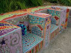 several colorful benches sitting next to each other