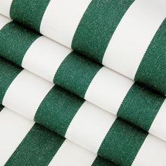 three green and white striped fabrics stacked on top of each other