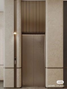 an elevator in a building with marble walls and flooring that has vertical blinds on the doors