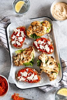 chicken parmesan burgers on a tray with dipping sauce