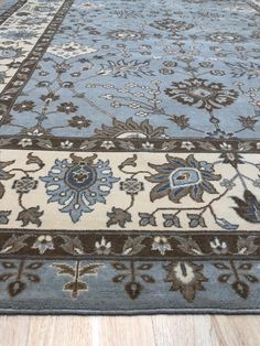 a blue and brown rug on the floor