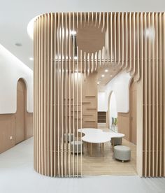 an office with wooden slats covering the walls