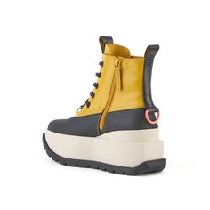 The Roko Patrol Boot is a functional lace-up style for everyday wear, featuring a vegetan leather and rubber coated nylon upper, a bold cleated outsole, UN's signature aesthetics, signature pull-ups, and a defining block logo. Product Note: The midsole is made from polyurethane, a durable, lightweight, and flexible material with subtle micropores that will vary in texture. Normal fit Heel height: 60mm/2.4in Vegetan leather and rubber-coated nylon upper Leather lining Rubber outsole Nice Boots, Block Logo, United Nude, September Birthstone Jewelry, Gifts For New Mums, Jewelry Ring Box, Pearl Jewellery Earrings, Cool Boots, Evil Eye Jewelry