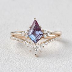 a ring with an amethorate and diamonds on it