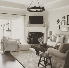 a living room filled with furniture and a fire place