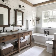 a bathroom with two sinks and a tub