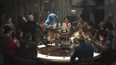 a group of people sitting around a round table in front of a giant blue creature