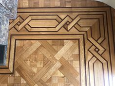 a wooden floor with an intricate design on the top and bottom part inlays