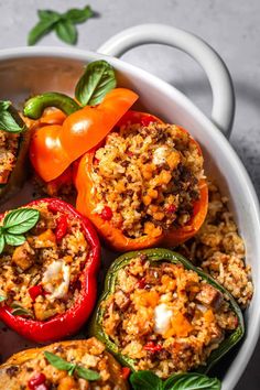 stuffed peppers with rice and basil in a white bowl