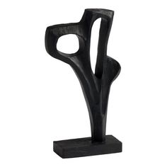 a black sculpture is shown on a white background, it looks like an abstract piece of art