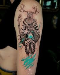 a man with a deer tattoo on his arm