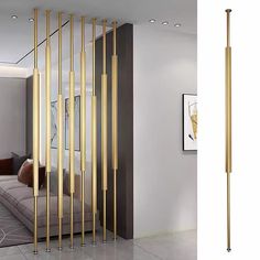 a room divider with gold poles in the middle and an image of a couch behind it