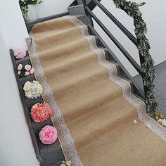 a carpeted stair case with flowers on it