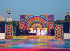 an outdoor stage set up with colorful decorations