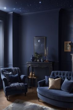 a living room with blue walls and furniture