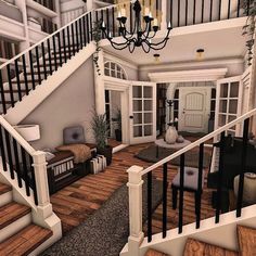 a living room filled with furniture and a chandelier