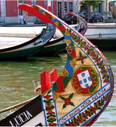 two boats in the water next to each other