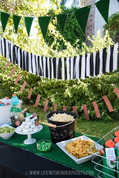 an outdoor party with food and decorations