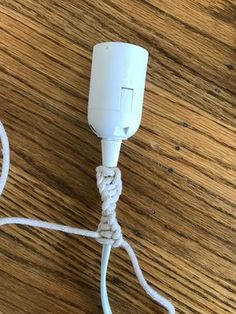 a white cord plugged into an ipod charger