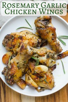 rosemary garlic chicken wings on a white plate with text overlay that reads rosemary garlic chicken wings