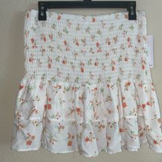 Brand New Skirt Or Top. This Is So Cute And Sweet! This Can Be Worn As A Skirt Or A Top. I Have Another One Very Similar In Color Mine Is Also White But Has More Green This Has More Peach. They Are Flowers With Peach And A Little But Of Yellow And And Bluish Green. It Is Adorable On And Like I Said Cute Both Ways. Tags Are Still Attached. I Love My Other One So Much I Didn’t Know If I Wanted To Sale But The One I Have Is Almost Identical. Looks Cute With Dr. Martens If You Want To Wear In Fall. Brunch Mini Skirt With Elastic Waistband, Cute Fitted Floral Print Skirt, Cute White Floral Print Skirt, Cute Flowy Skirt For Summer, Cute Mini Skirt With Elastic Waistband, Cute Fitted Beach Skirt, Cute White Skirted Bottoms, Cute Skirt For Spring Day Out, Cute Lined Skirt For Day Out