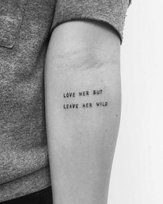 a woman's arm with the words love her but leave her wild on it