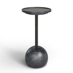 a round table with a metal base and black iron legs on an isolated white background