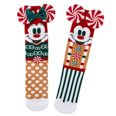 Show off your whimsical holiday style with this pair of Disney crew socks. Cute and colorful novelty socks feature a gingerbread version of Disney Mickey Mouse on one sock and a coordinating Disney Minnie Mouse design on the other. With peppermint Mickey ears attachments, a green bow accent and candy designs decorating the mismatched socks, this fun Disney footwear makes the perfect Christmas gift or stocking stuffer for a Disney fan. | Disney crew socks feature mismatched but coordinating gingerbread designs of Mickey Mouse and Minnie Mouse. | Makes a sweet Christmas gift for Disney fans. | Imported. Cotton, polyester, nylon, spandex. | Machine wash cold. Do not bleach. Line dry. Do not iron. Do not dry clean. | One size fits most adults. Disney Candy Christmas, Gingerbread Christmas Slippers, Disney Christmas Socks, Disney Stockings Christmas, Gingerbread Designs, Harry Potter Pets, Mismatched Socks, Grinch Who Stole Christmas, Socks Cute