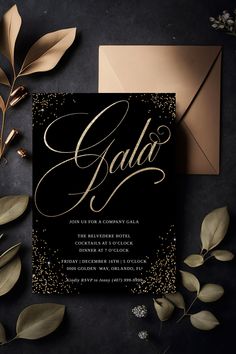 an elegant black and gold wedding card with the word gala on it, surrounded by greenery