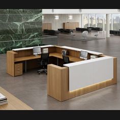 an office cubicle with two desks and one chair in the middle, on concrete flooring