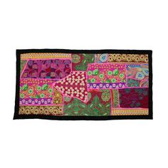 a colorful patchwork rug with many different colors and patterns on the front, along with a black border