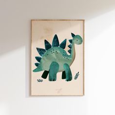 a painting of a green dinosaur on a white wall