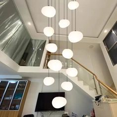 a room that has some lights hanging from the ceiling