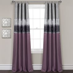 the curtains in this room are purple and grey, with silver trimmings on them