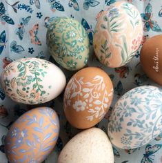 an assortment of painted eggs sitting on top of a table