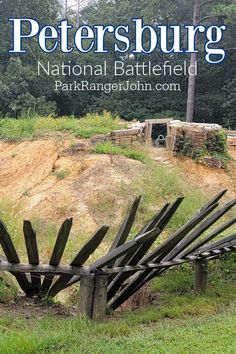 there is a wooden fence in the grass with trees behind it and text overlay that reads, peterburg national battle field