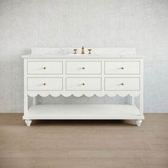 a white bathroom vanity with scalloped drawers