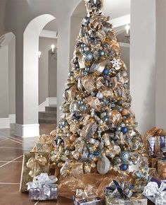 a decorated christmas tree with presents under it